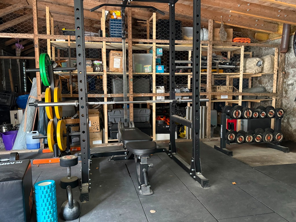 Home gym with power rack and barbells